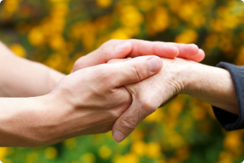 Two people holding hands